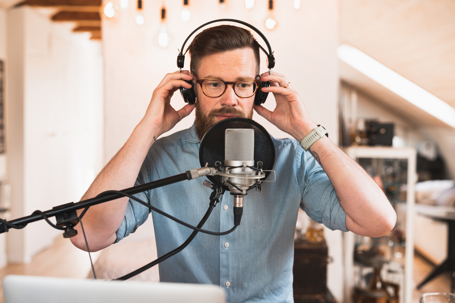 Podcast host is putting on his headphones